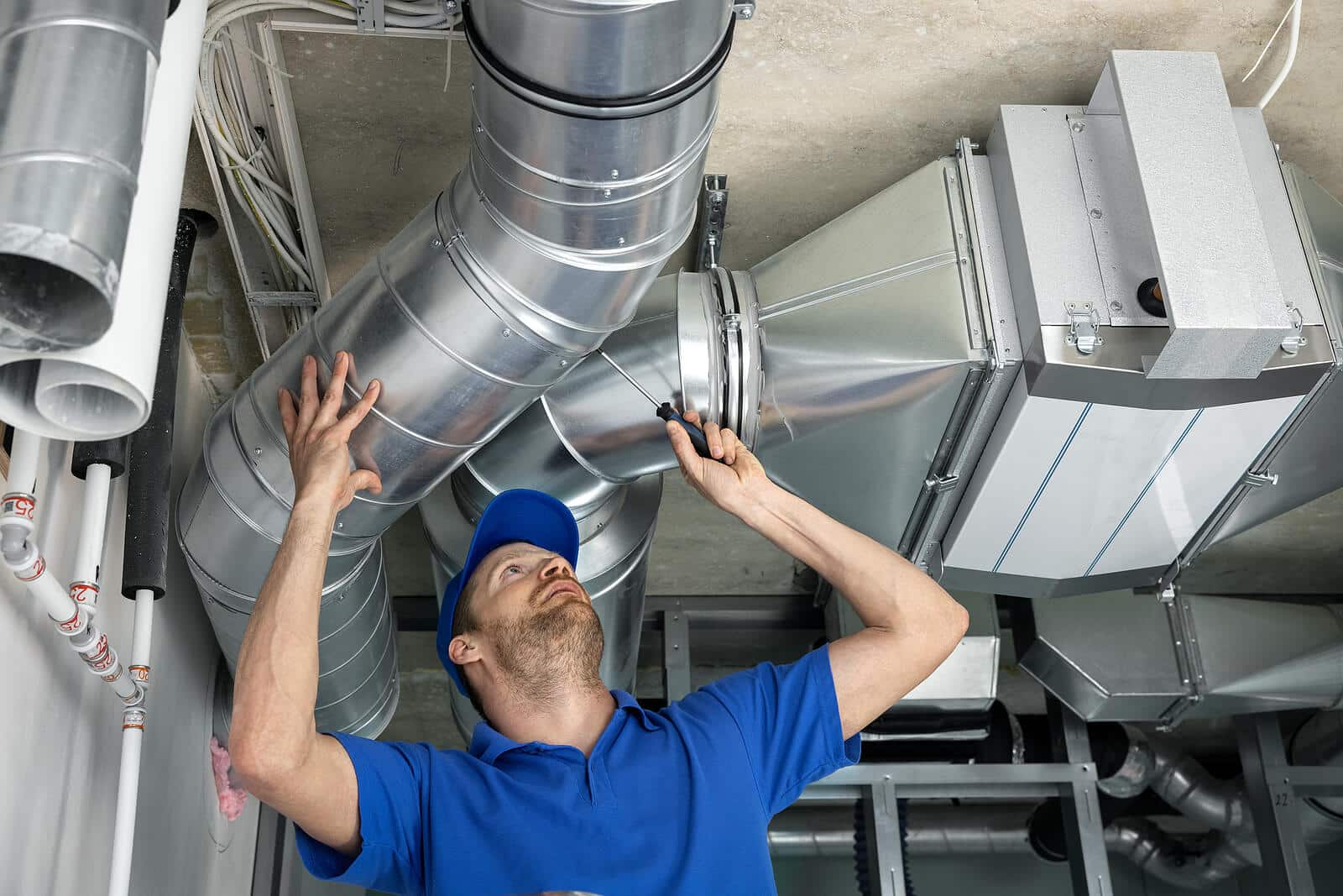 HVAC technician inspecting and repairing air ducts in Sunnyvale