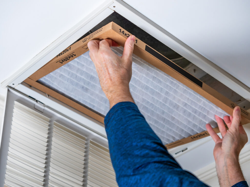 HVAC technician replacing a home air filter in Sunnyvale