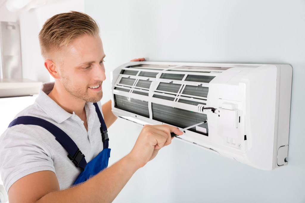 HVAC technician maintaining a ductless air conditioner in Sunnyvale