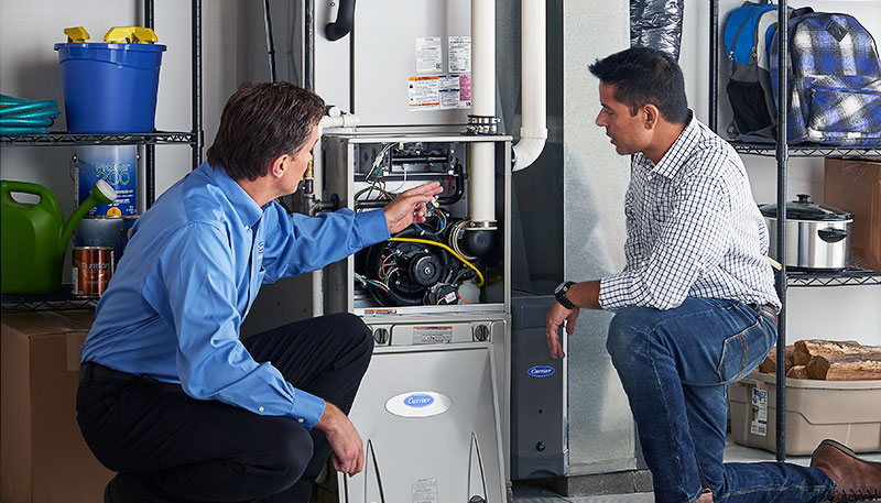 Technician evaluating a furnace for repair or replacement in Sunnyvale