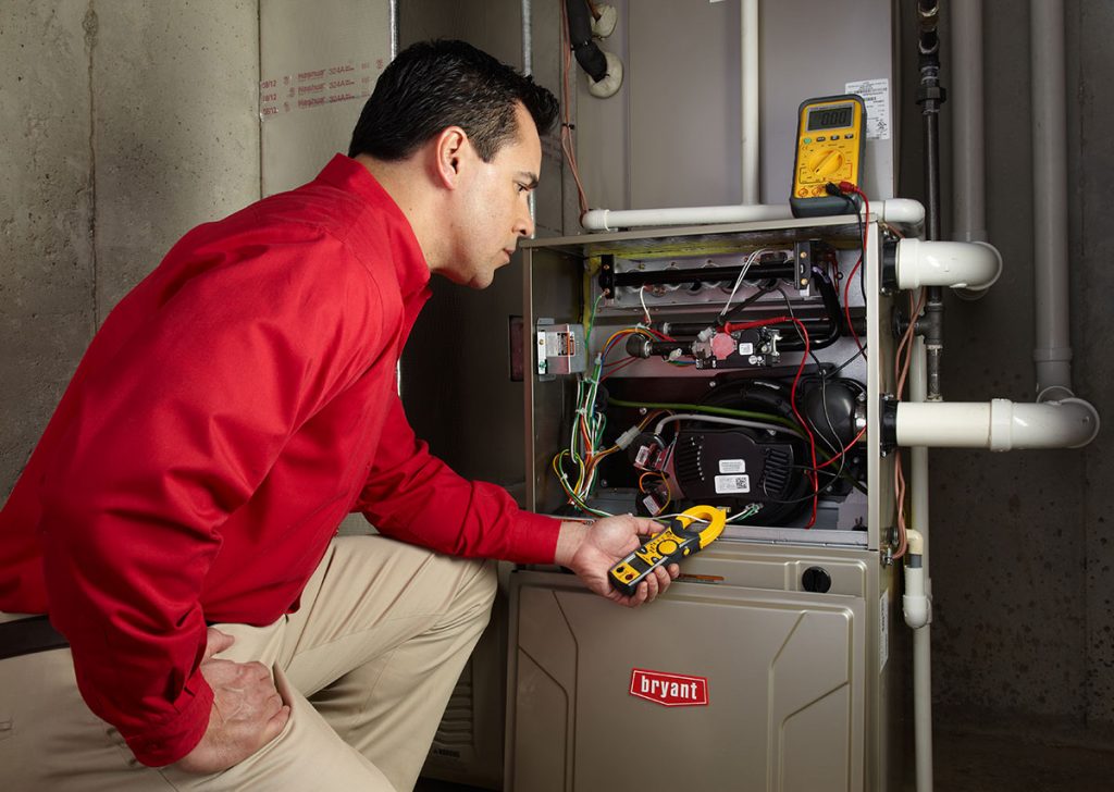 Heating technician diagnosing a furnace repair in Sunnyvale