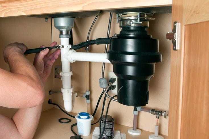 Plumber repairing a garbage disposal in Sunnyvale