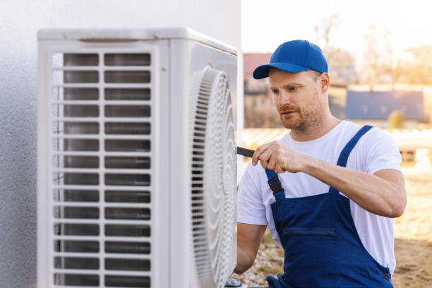 HVAC technician servicing an outdoor air conditioner in Sunnyvale