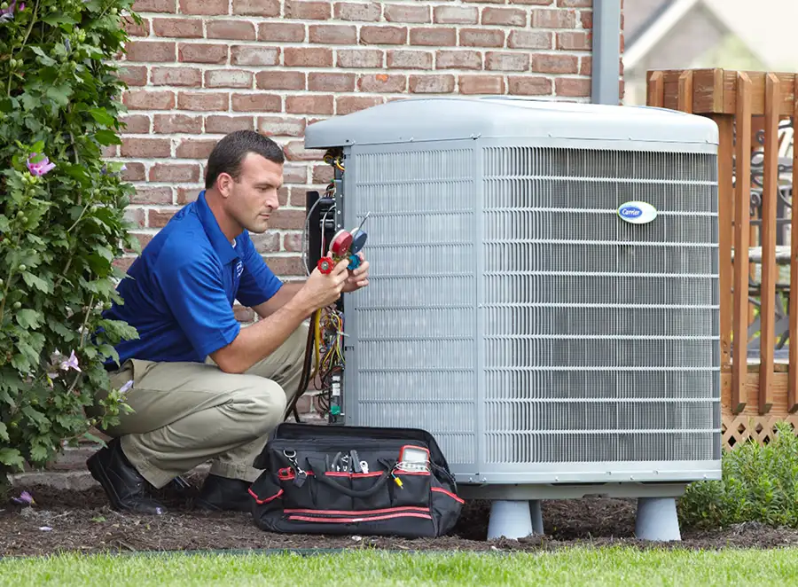 HVAC technician inspecting an outdoor AC unit in Sunnyvale