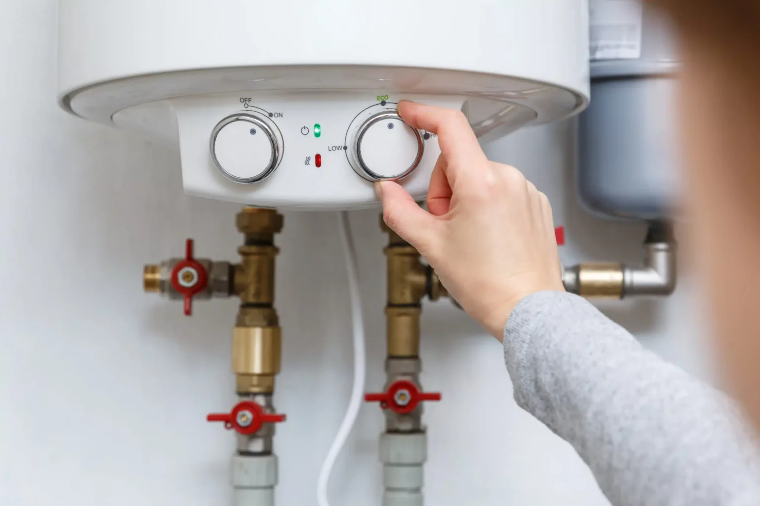 Technician adjusting a water heater in Sunnyvale